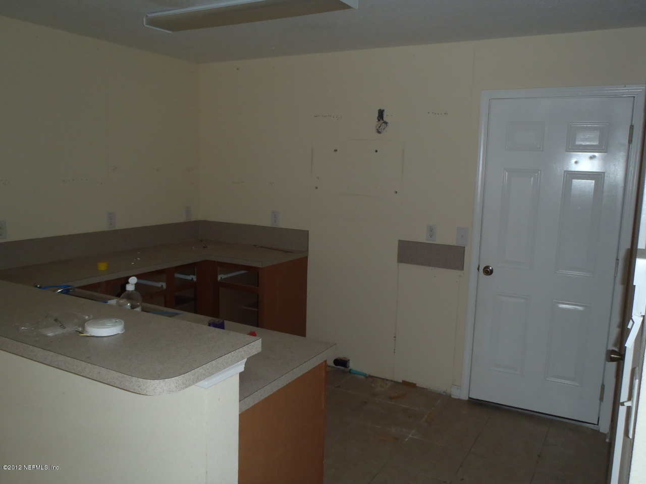 6700 Bowden Road, Unit 302 Jacksonville, FL 32216 - Photo 8 of 11 a kitchen with a sink and cabinets