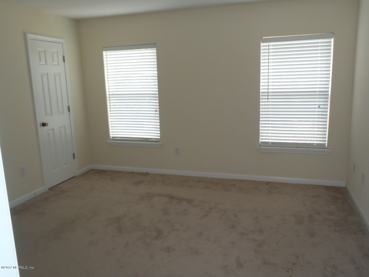 6700 Bowden Road, Unit 302 Jacksonville, FL 32216 - Photo 10 of 11 an empty room with a window