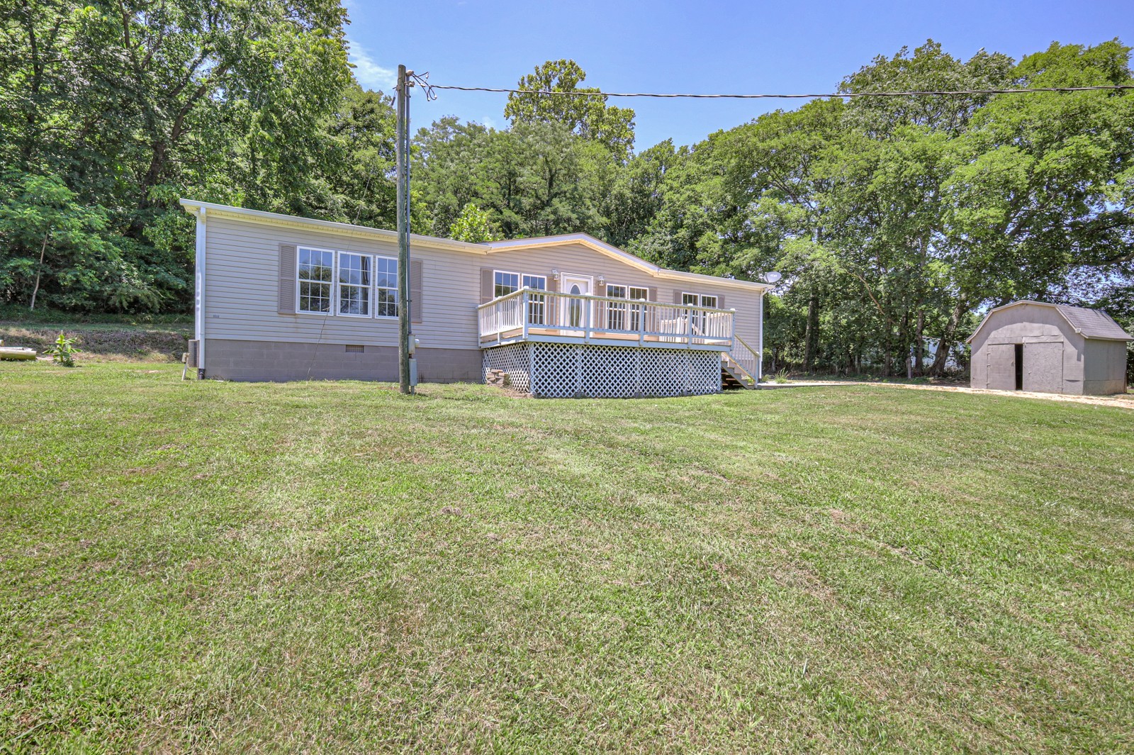4002 Rippey Lake Road Mount Pleasant, TN 38474 - Photo 29 of 43 a view of a house with a yard