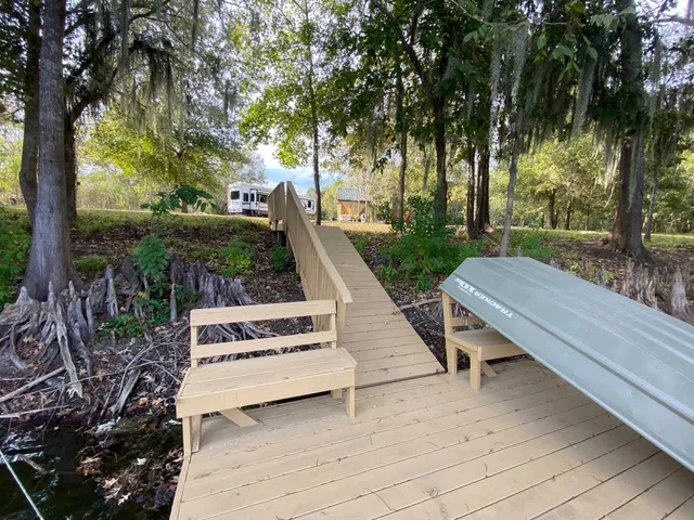 a view of backyard with trees and outdoor seating