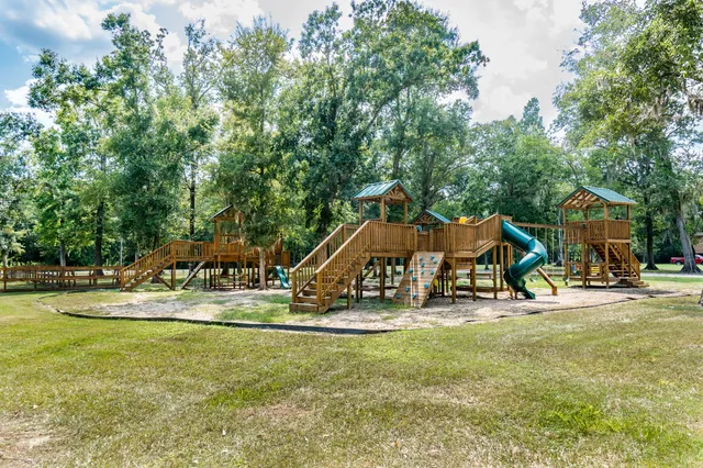 a view of a park with swings and slides