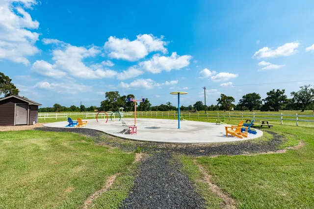 a view of a house with swimming pool and yard