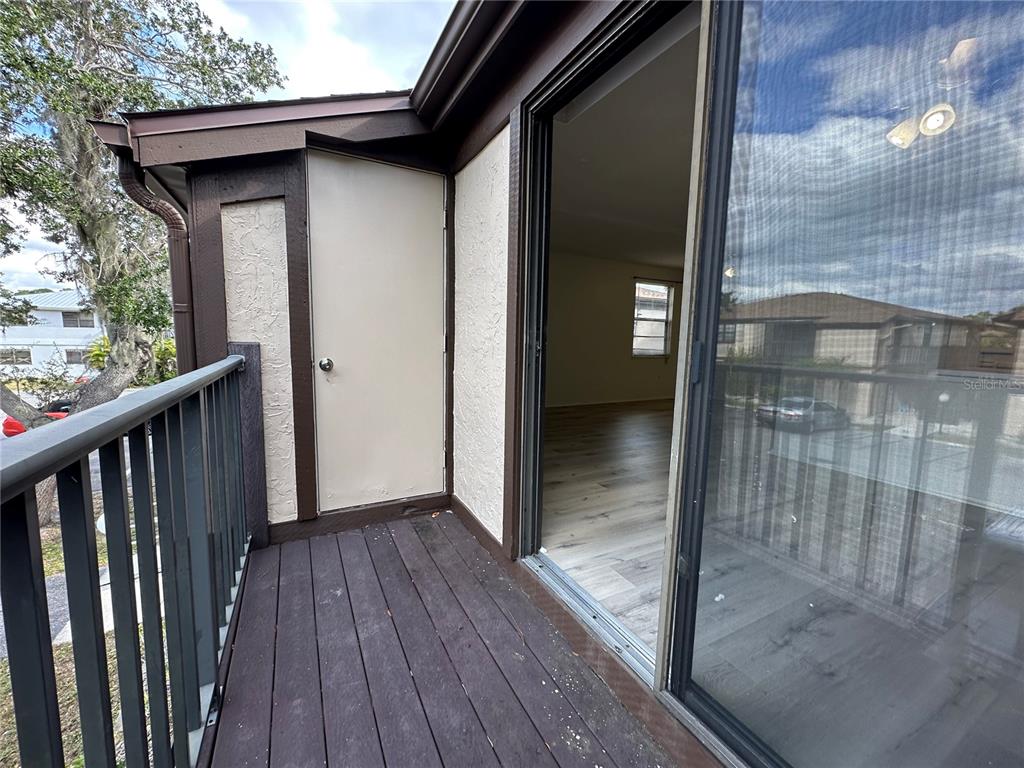4022 Beaver Lane, Unit 1000H Port Charlotte, FL 33952 - Photo 20 of 24 a view of a hallway with wooden floor