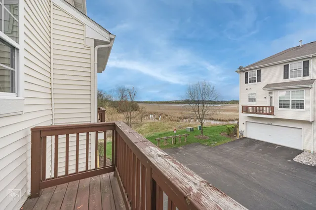 a view of a balcony with wooden floor