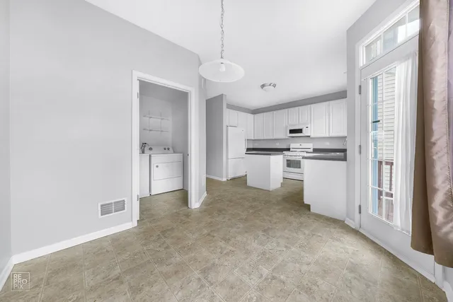 a view of a kitchen with a sink cabinets and a window