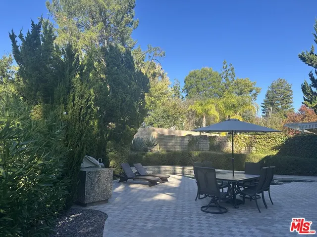 a view of a swimming pool with a outdoor seating area
