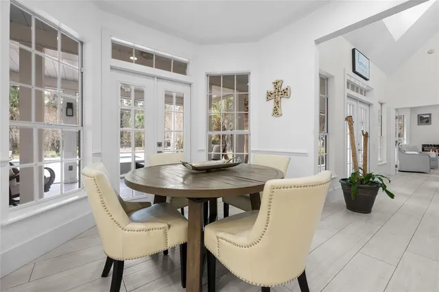 a spacious en suite bathroom with double sink and a large mirror