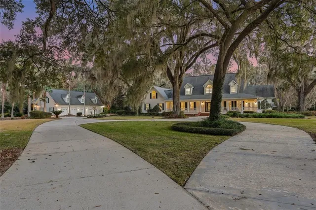a house view with a sitting space and garden