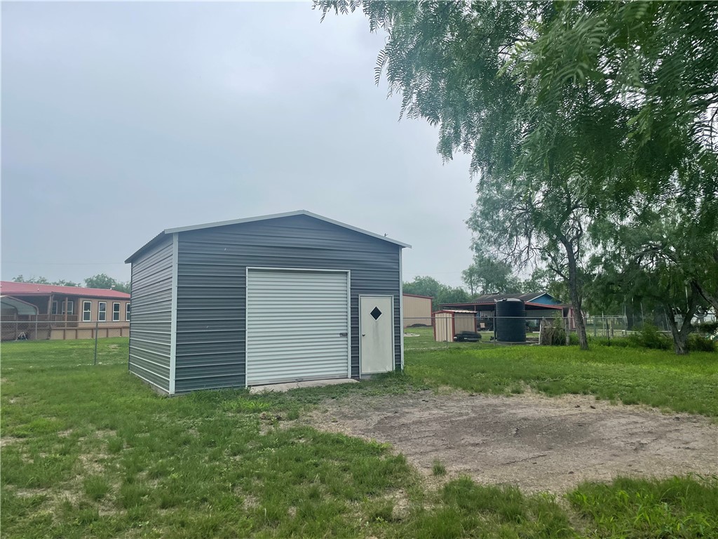 9673 County Road 350 Mathis, TX 78368 - Photo 2 of 6 a house with a yard
