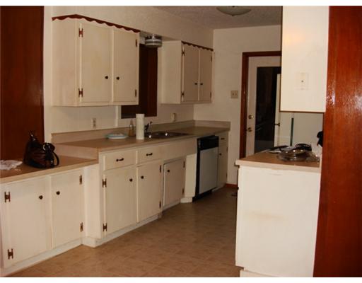 116 Rice Drive Portland, TX 78374 - Photo 4 of 4 a kitchen with cabinets appliances and a counter