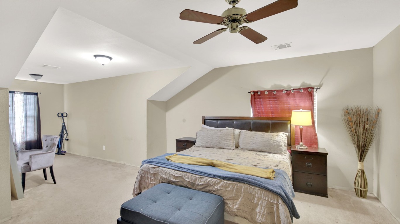 120 Rio Vista Ranch Road Dale, TX 78616 - Photo 15 of 22 a bedroom with a bed and a chandelier