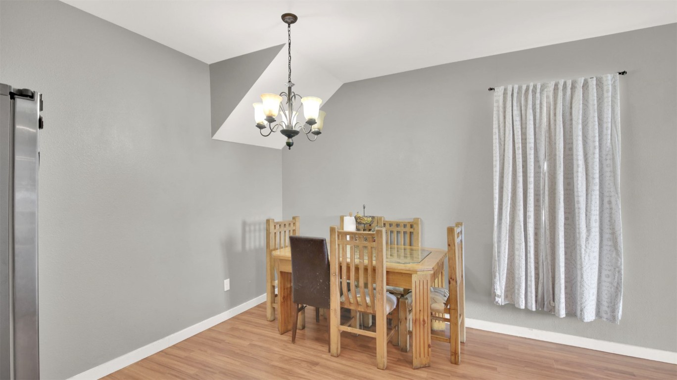 120 Rio Vista Ranch Road Dale, TX 78616 - Photo 8 of 22 a view of a dining room with furniture wooden floor and chandelier