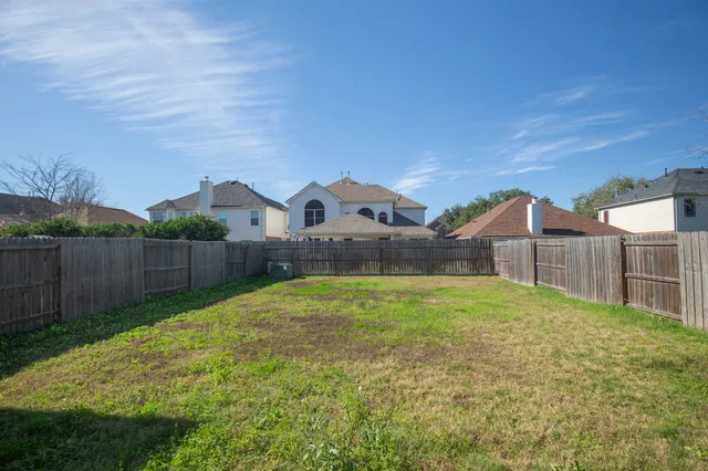 a house view with a play ground in front of it