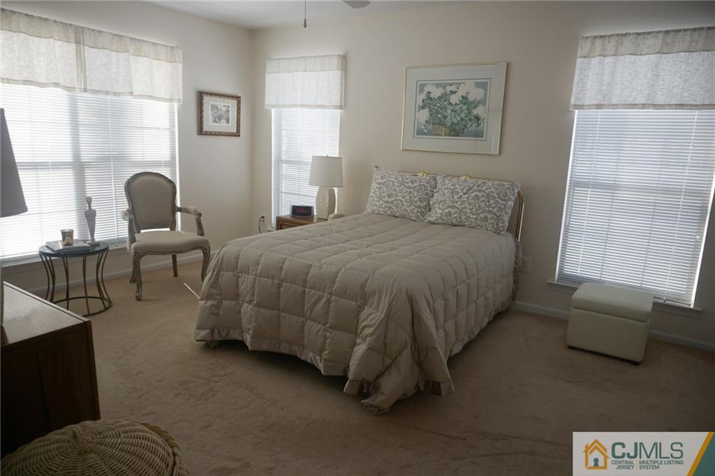 2408 Timber Oaks Road, Unit 2408 Edison, NJ 08820 - Photo 14 of 20 a bedroom with a bed and window