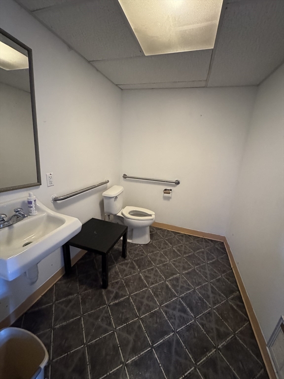 435-455 State Street Springfield, MA 01105 - Photo 13 of 13 a bathroom with a sink toilet and a mirror
