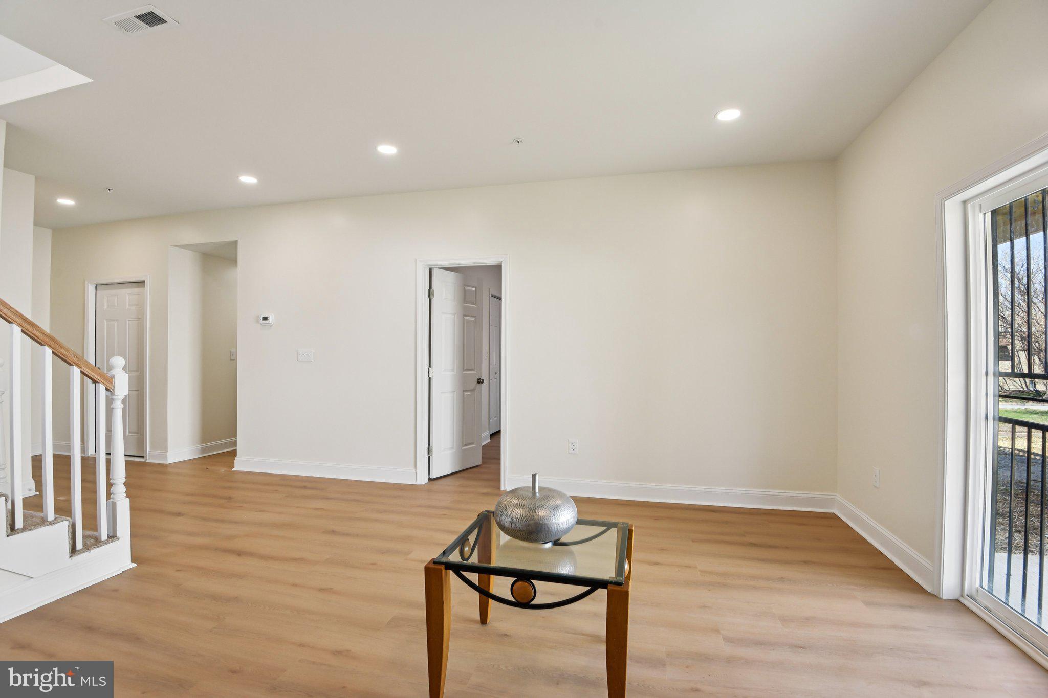 2223 Roslyn Avenue Baltimore, MD 21216 - Photo 14 of 32 a view of a room with furniture and wooden floor