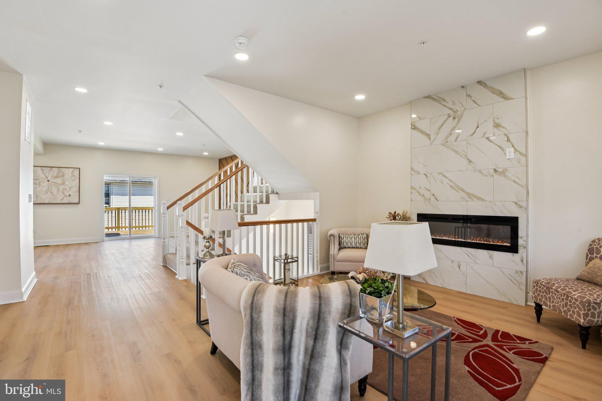 2223 Roslyn Avenue Baltimore, MD 21216 - Photo 2 of 32 a living room with furniture and wooden floor