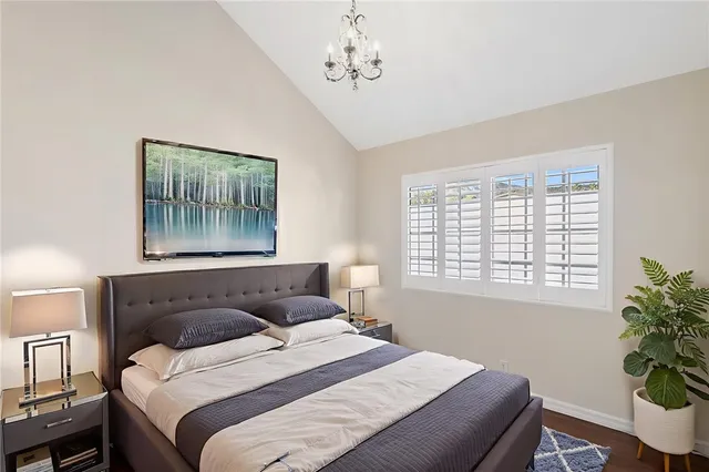 a bathroom with a double vanity sink toilet mirror and bathtub