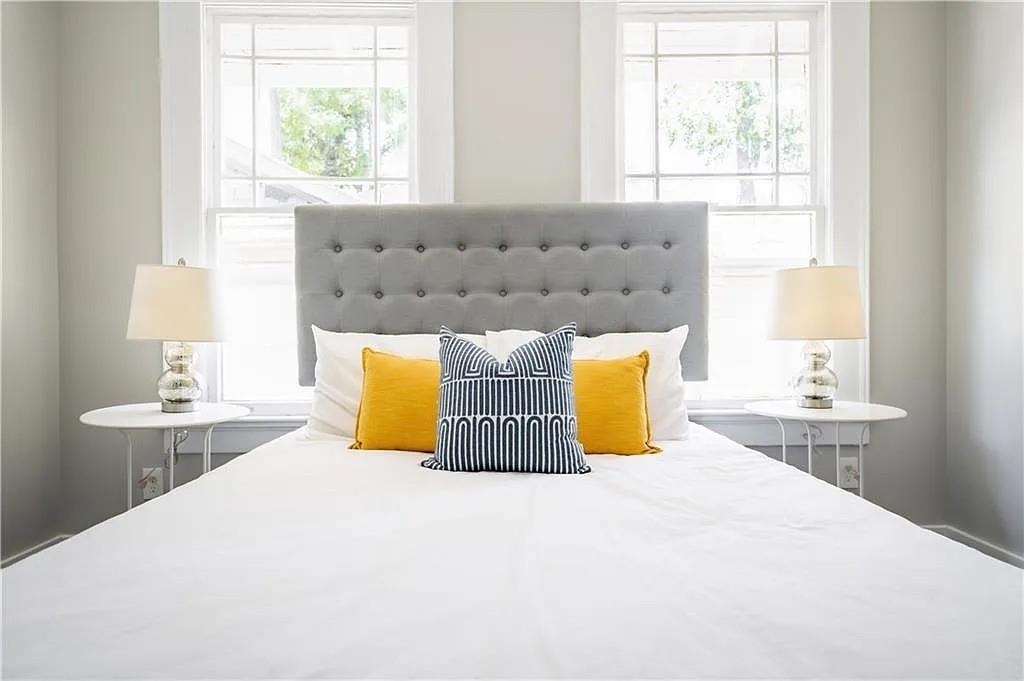 943 Rose Circle Southwest Atlanta, GA 30310 - Photo 14 of 33 a bed sitting in a bedroom next to a window