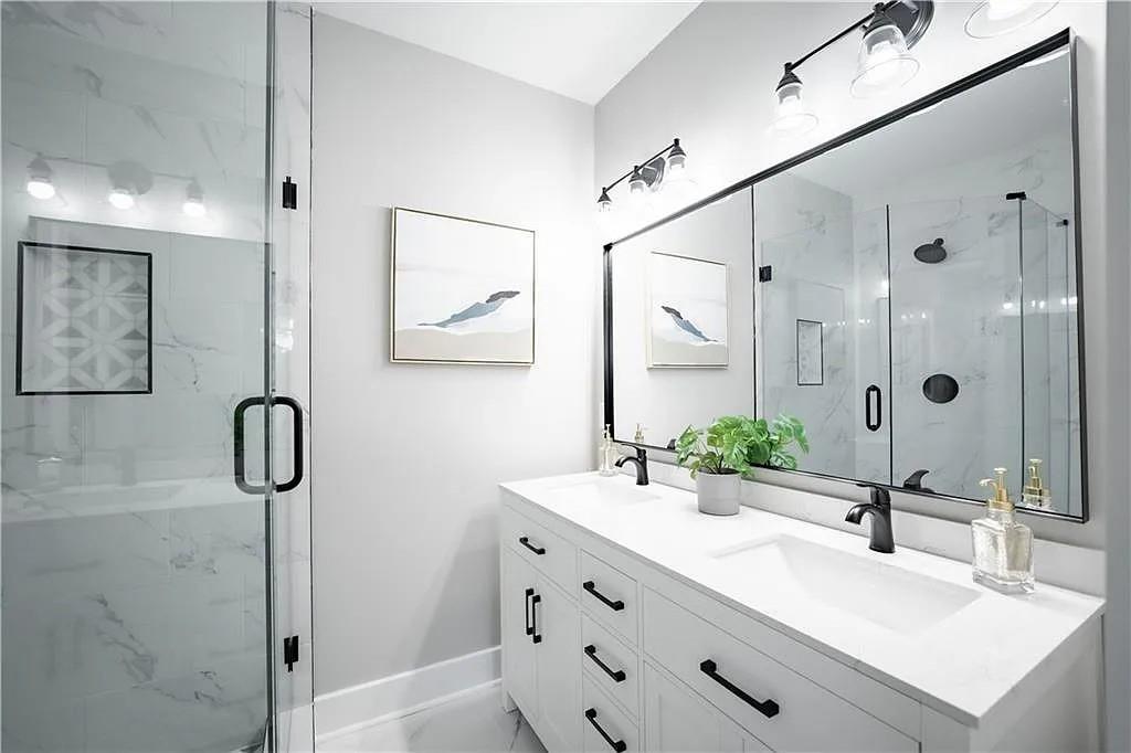 943 Rose Circle Southwest Atlanta, GA 30310 - Photo 20 of 33 a bathroom with a double vanity sink mirror double vanity and shower