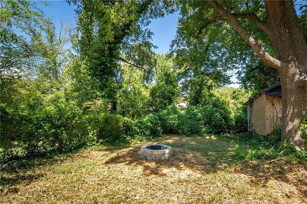 943 Rose Circle Southwest Atlanta, GA 30310 - Photo 28 of 33 a view of a yard with plants and large trees