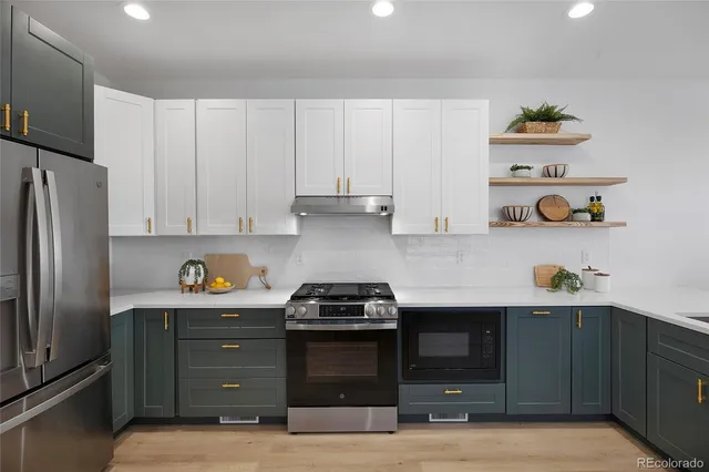 a kitchen with cabinets and appliances