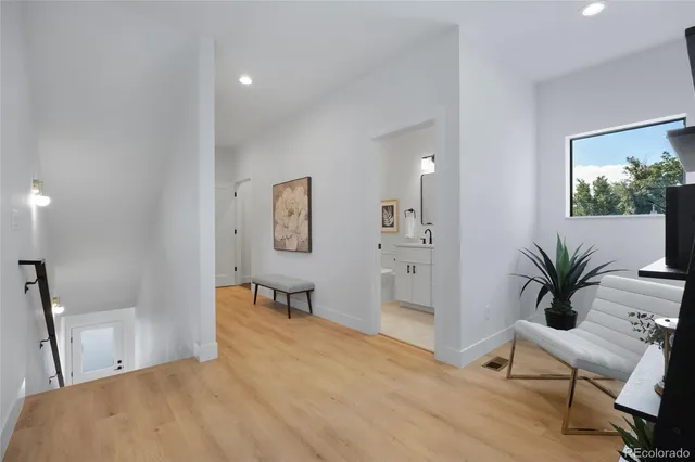 a bedroom with furniture and a potted plant