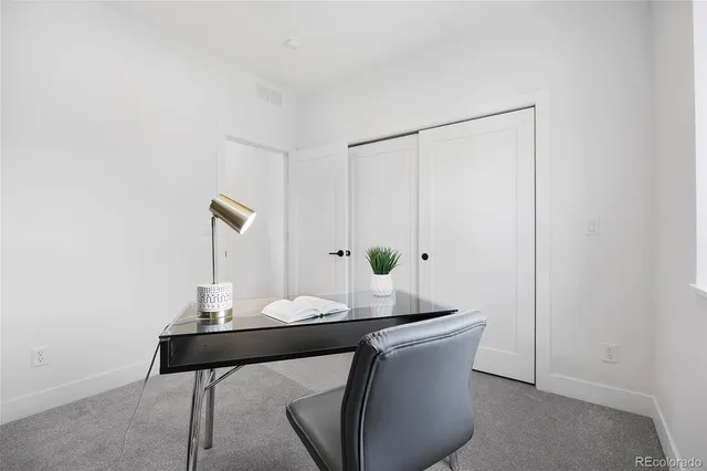 a view of a workspace with furniture