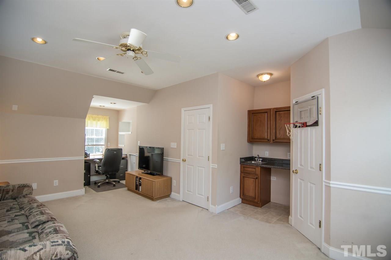 1906 Patterson Grove Road Apex, NC 27502 - Photo 16 of 27 Large Room that could be used as a 4th Bedroom or a Bonus Room. Has a Wet Bar & Walk-In Closet