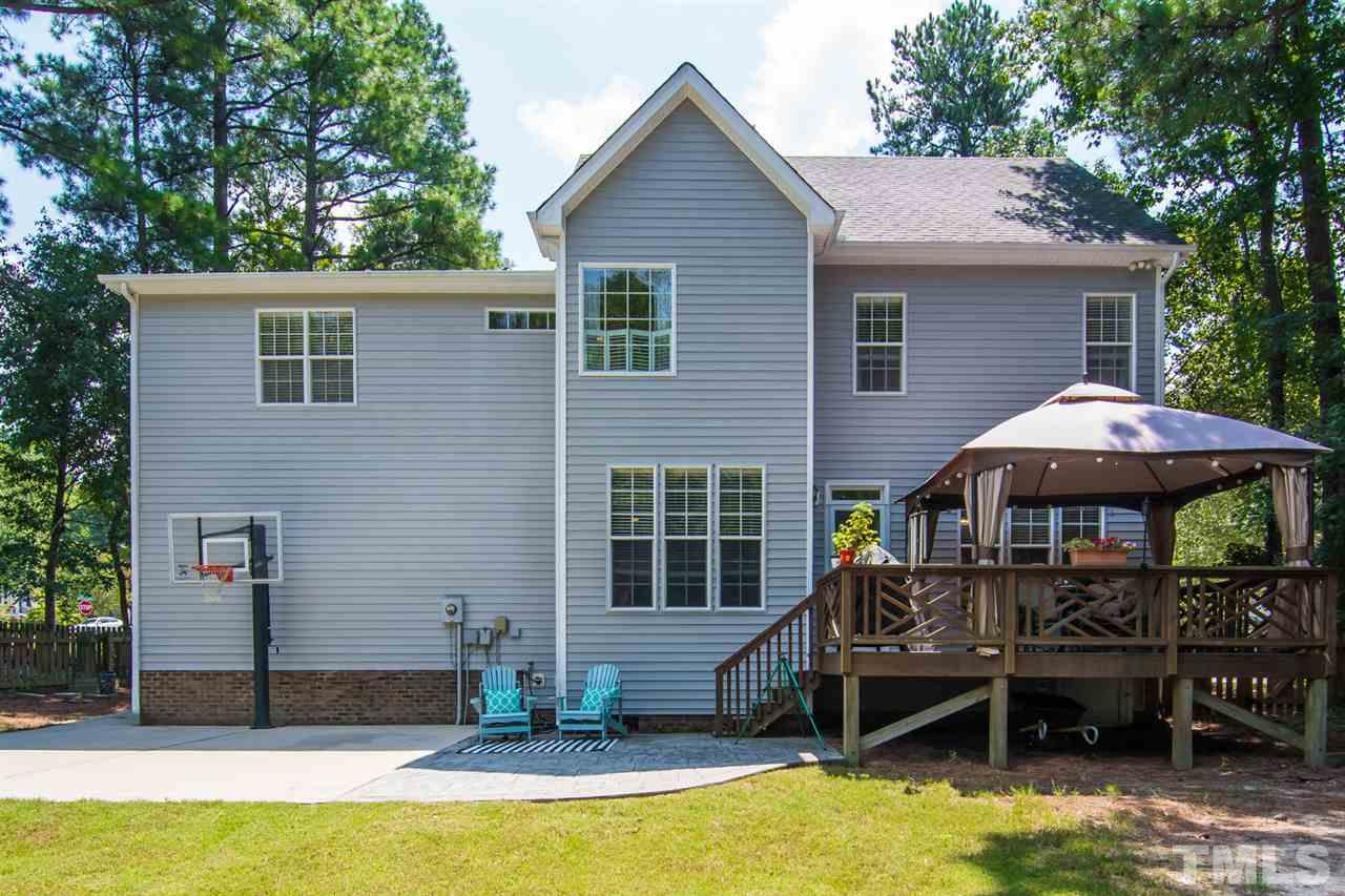 1906 Patterson Grove Road Apex, NC 27502 - Photo 21 of 27 Fenced Backyard has a Concrete Basketball Court, Patio & Deck