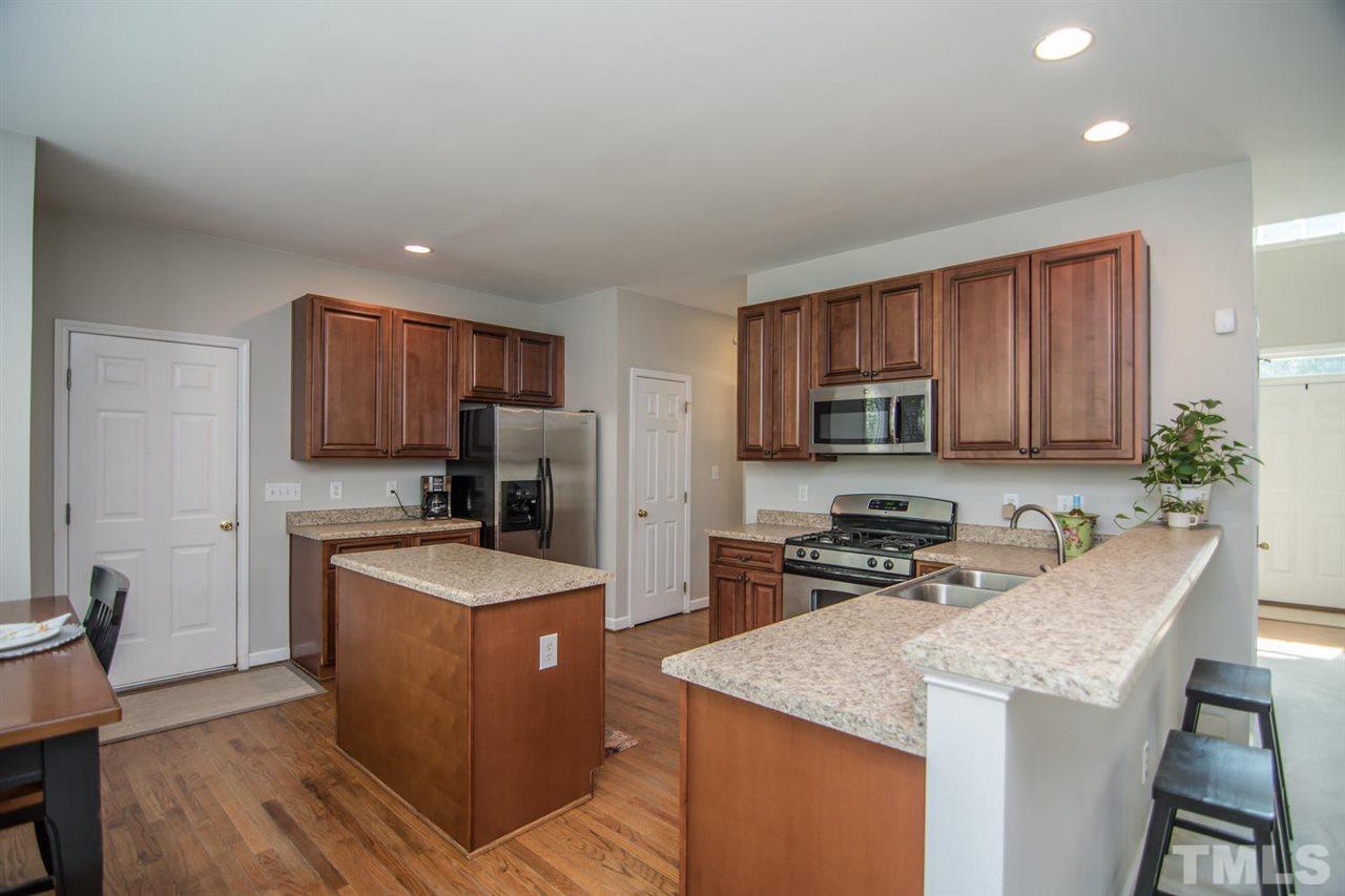 1906 Patterson Grove Road Apex, NC 27502 - Photo 8 of 27 Center Island and Gas Range