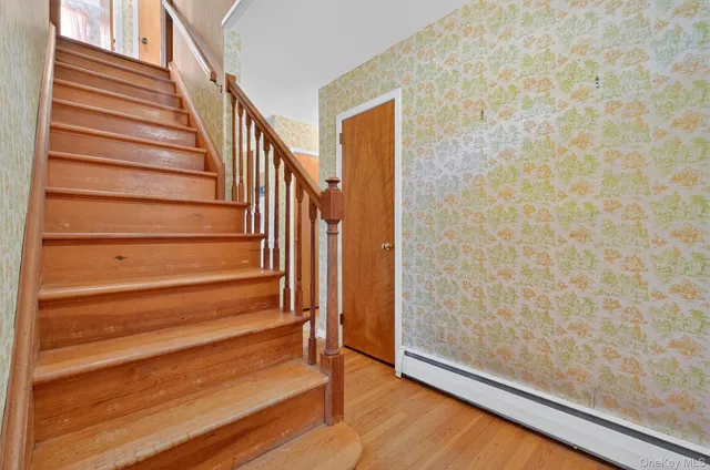 a view of entryway with wooden floor