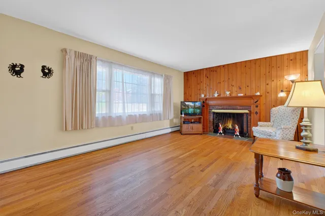 an empty room with furniture and a fireplace
