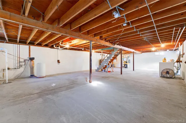 a view of a garage room with wooden walls