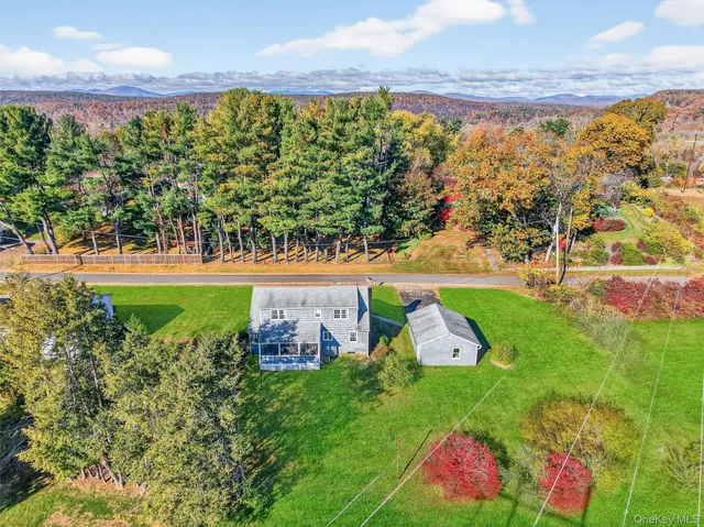 an aerial view of a houses with outdoor space