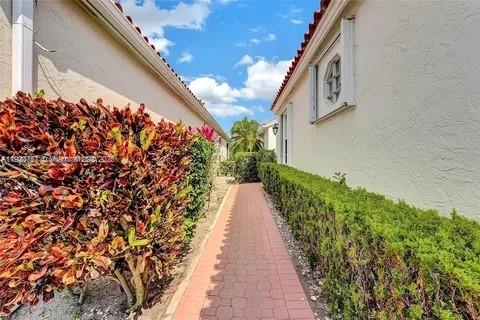 3951 Redondo Court Boca Raton, FL 33487 - Photo 11 of 30 a view of a pathway with a flower garden