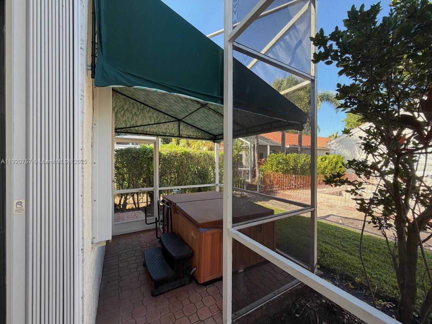 3951 Redondo Court Boca Raton, FL 33487 - Photo 12 of 30 a view of a porch with furniture and yard