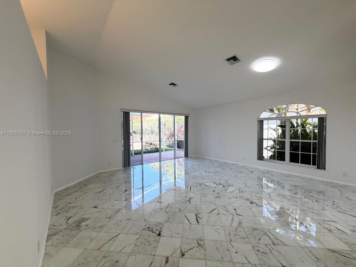 3951 Redondo Court Boca Raton, FL 33487 - Photo 18 of 30 a view of an empty room with a window