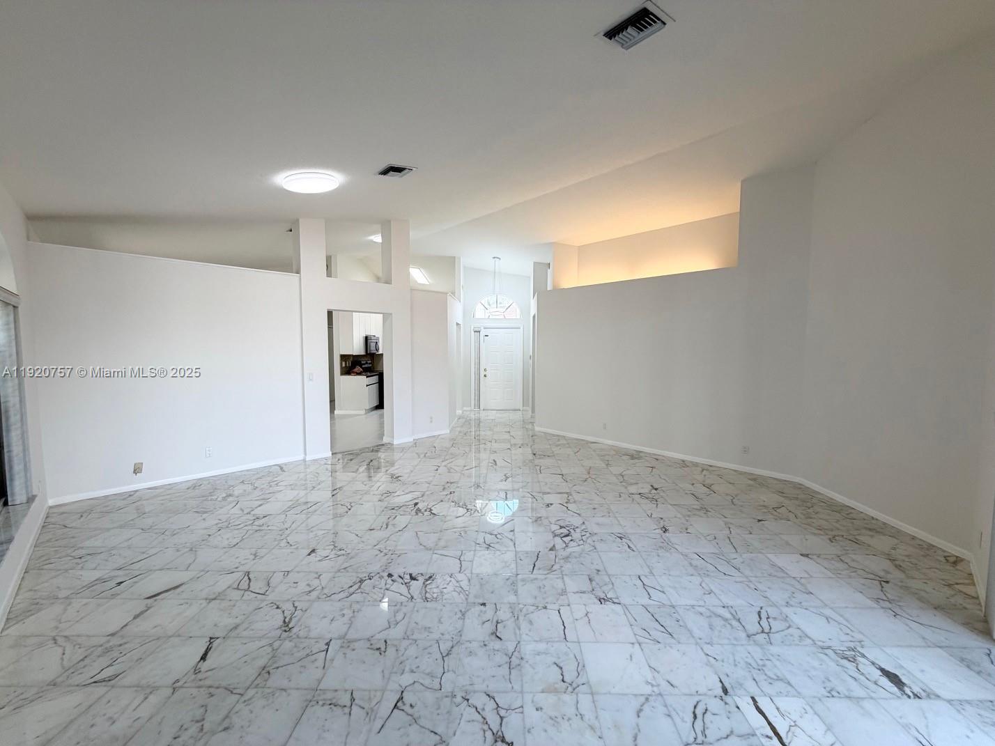 3951 Redondo Court Boca Raton, FL 33487 - Photo 19 of 30 a view of a big room with wooden cabinet and windows
