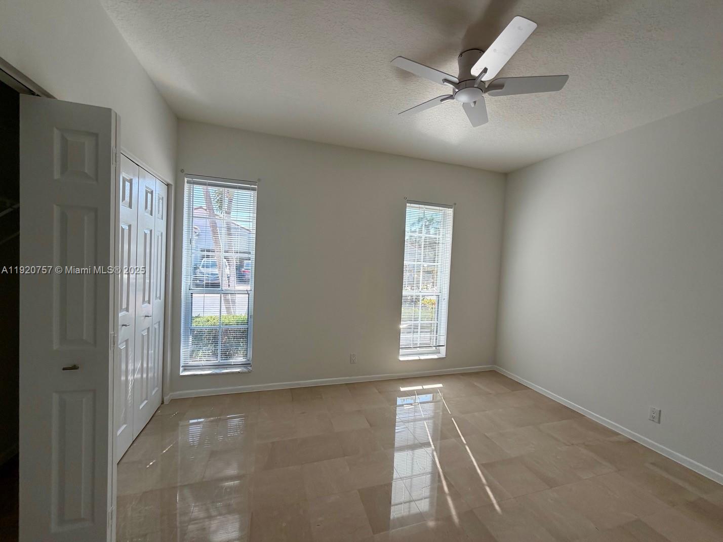 3951 Redondo Court Boca Raton, FL 33487 - Photo 20 of 30 a view of an empty room with a window