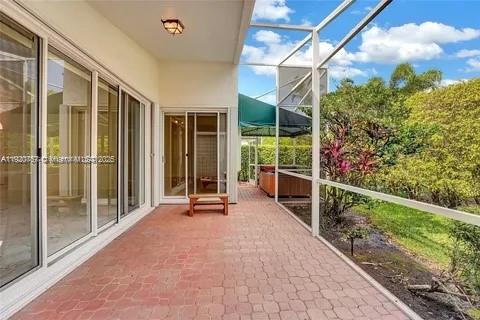 3951 Redondo Court Boca Raton, FL 33487 - Photo 8 of 30 a view of a porch with furniture and front door