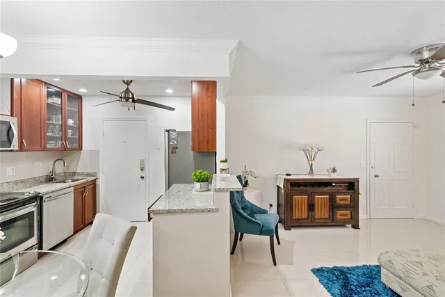 a living room with furniture a fireplace and decor