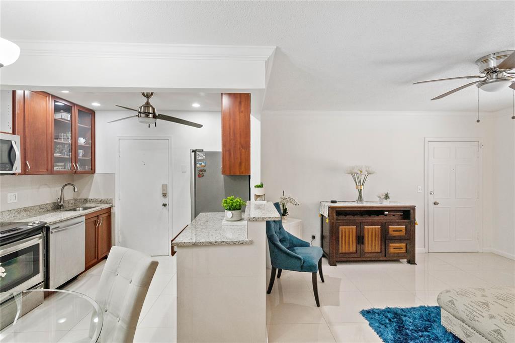 2151 Northeast 68th Street Fort Lauderdale, FL 33308 - Photo 12 of 45 a living room with furniture a fireplace and decor