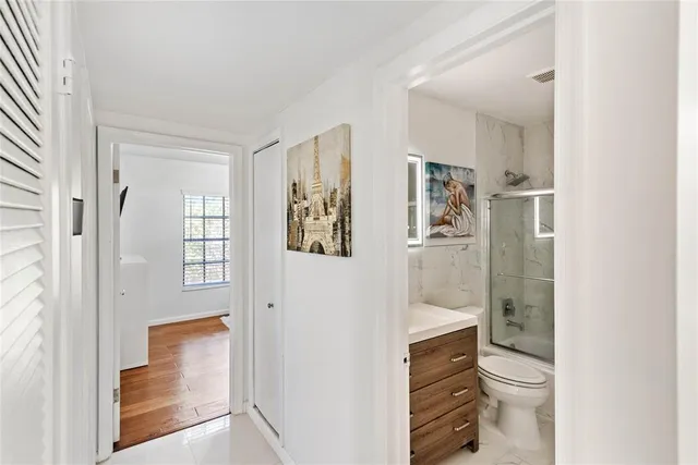 a bathroom with a shower toilet and sink