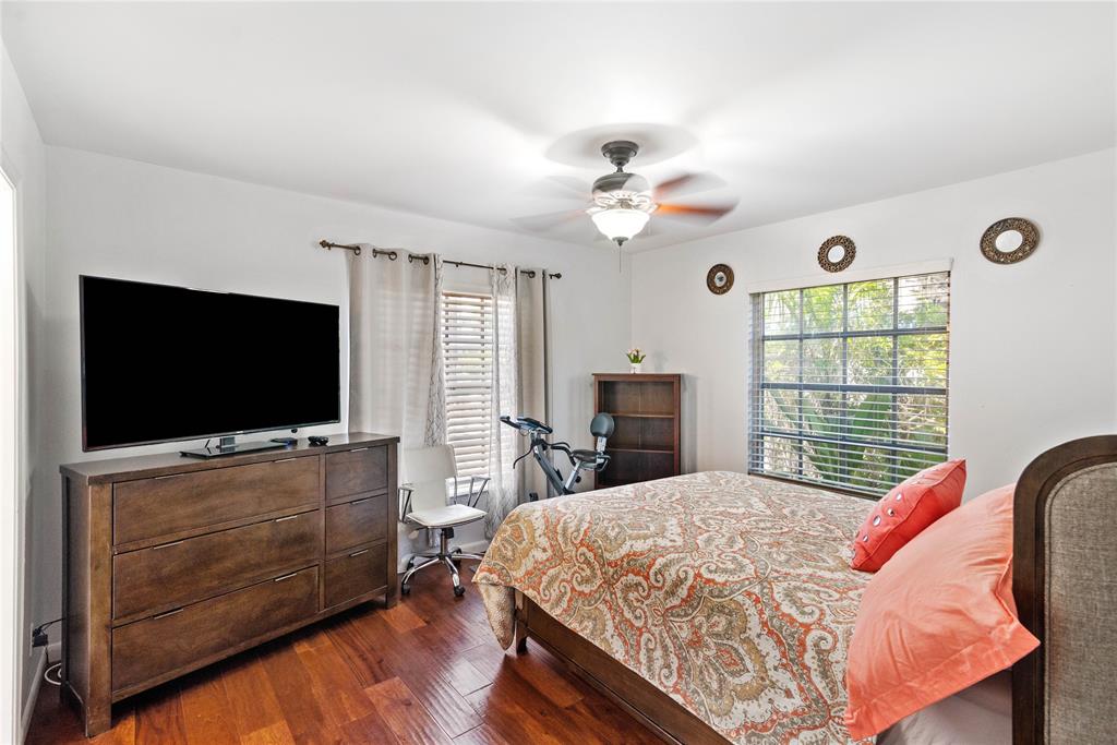 2151 Northeast 68th Street Fort Lauderdale, FL 33308 - Photo 18 of 45 a bedroom with a bed and a flat screen tv