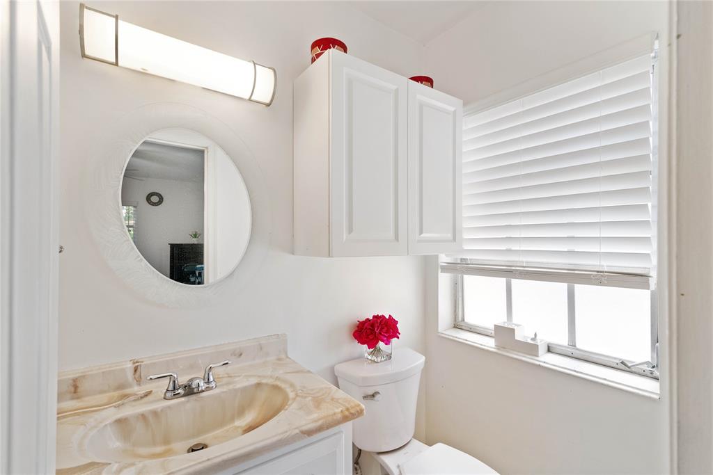 2151 Northeast 68th Street Fort Lauderdale, FL 33308 - Photo 21 of 45 a bathroom with a sink mirror and window
