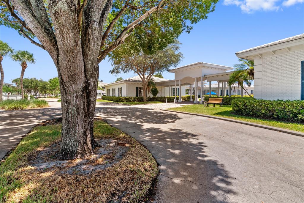 2151 Northeast 68th Street Fort Lauderdale, FL 33308 - Photo 22 of 45 a view of a street with a tree in front of it