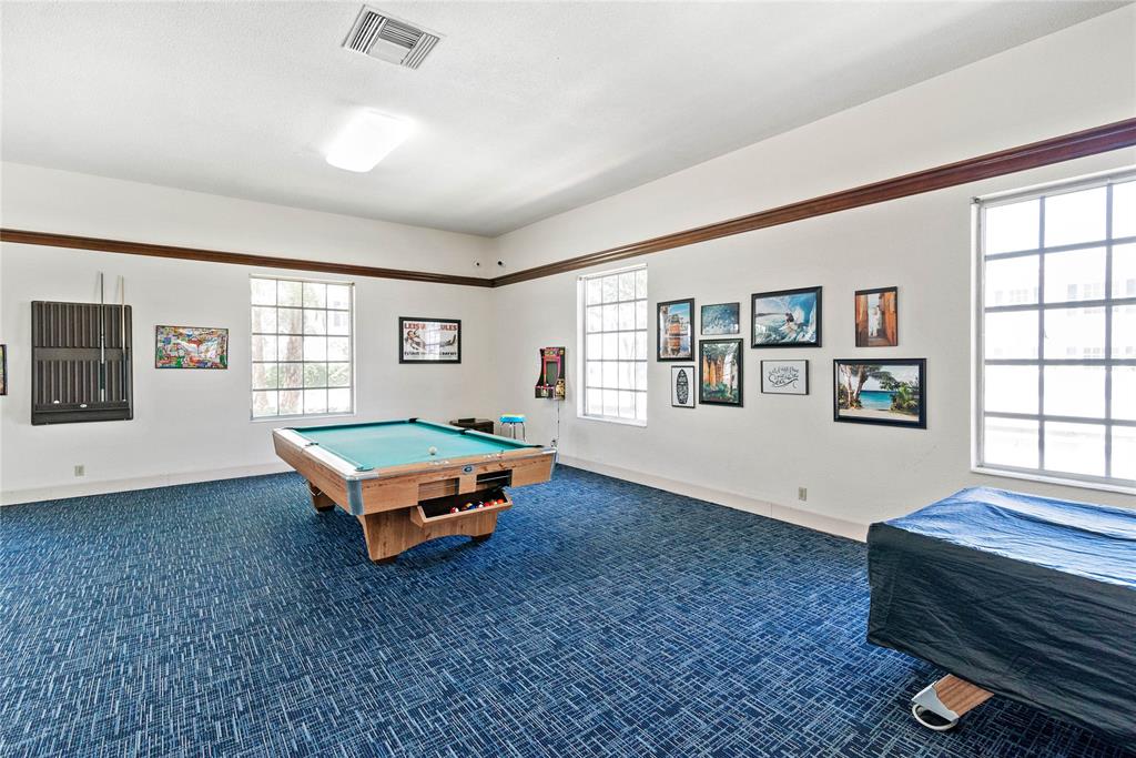 2151 Northeast 68th Street Fort Lauderdale, FL 33308 - Photo 25 of 45 a room with pool table and windows