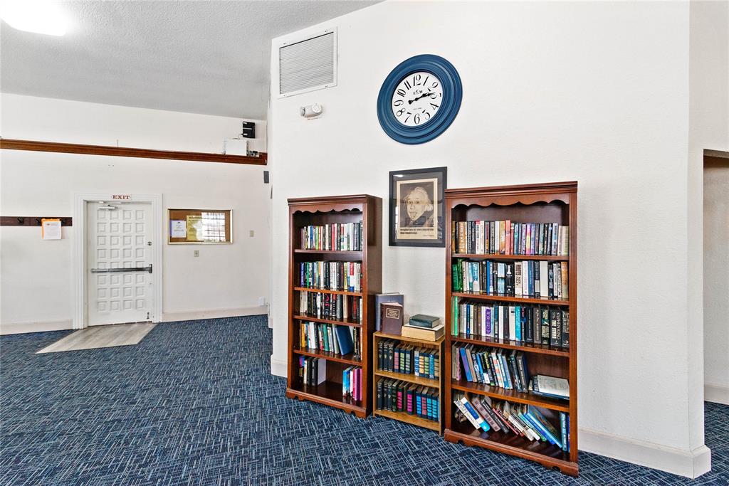 2151 Northeast 68th Street Fort Lauderdale, FL 33308 - Photo 27 of 45 a view of a book shelf with lots of books