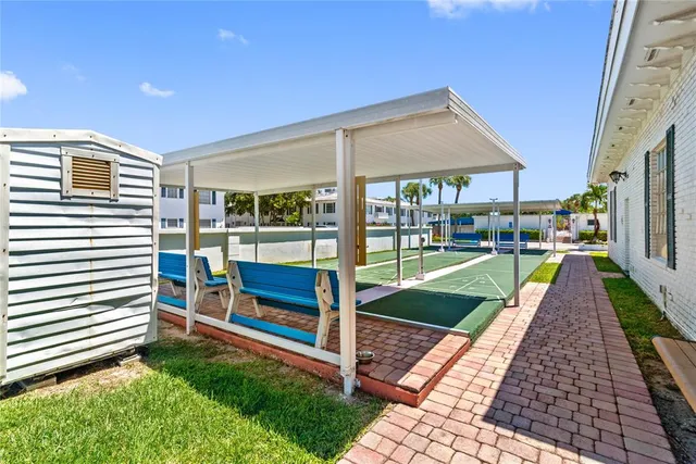 a view of a patio next to a yard